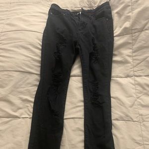 Buckle black ripped skinny jeans